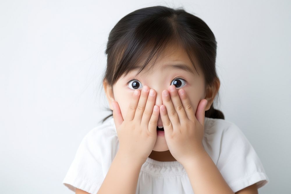 Surprised chinese child portrait photo hand. AI generated Image by rawpixel.