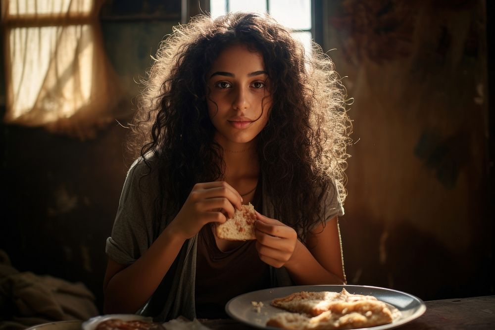 Middle eastern girl food eating bread. AI generated Image by rawpixel.