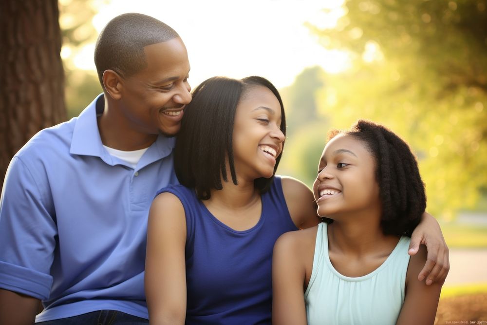African American family laughing outdoors day. AI generated Image by rawpixel.