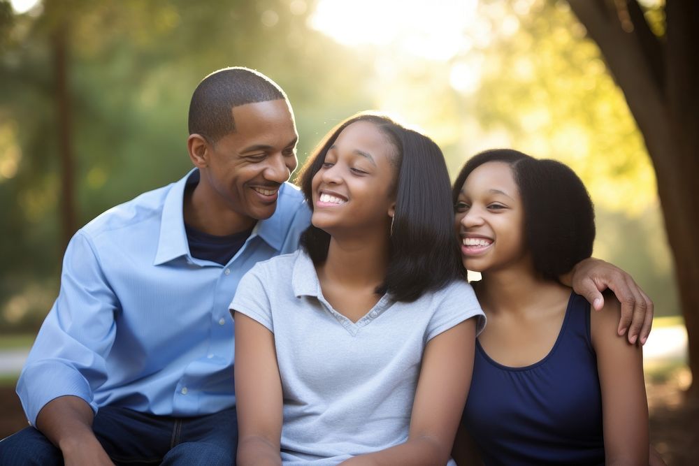 African American family laughing portrait outdoors. AI generated Image by rawpixel.