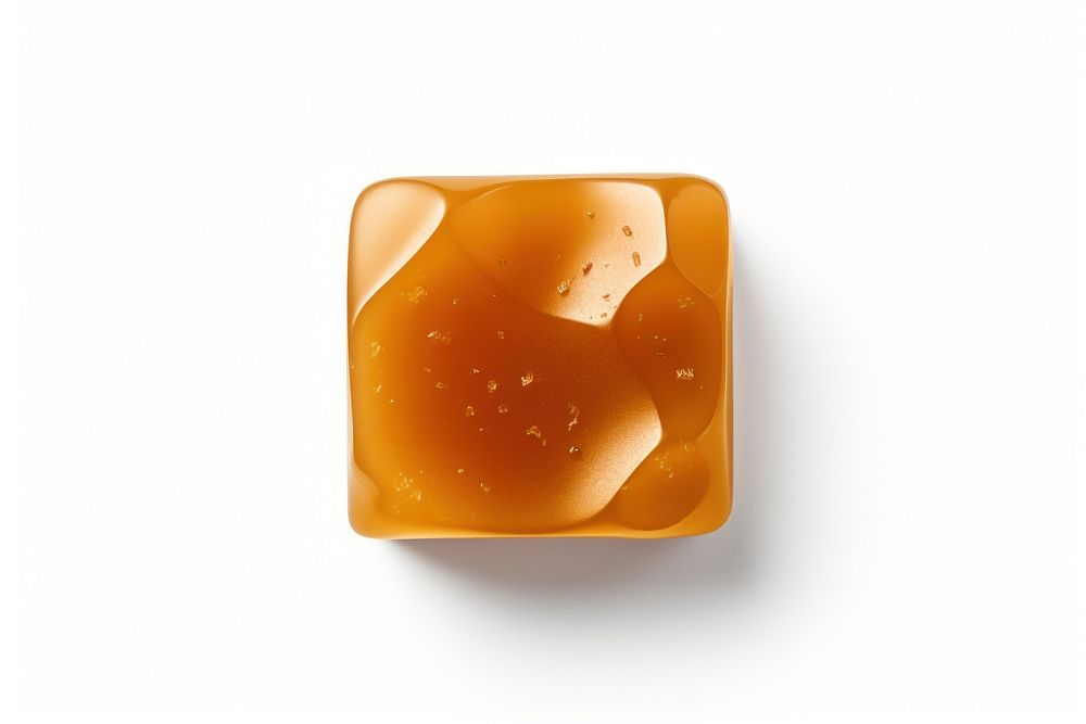 A butterscotch candie jewelry food white background. AI generated Image by rawpixel.