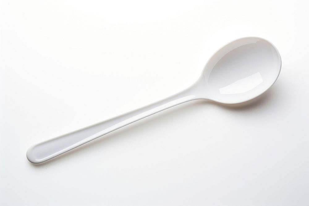 A plastic spoon white white background silverware. AI generated Image by rawpixel.