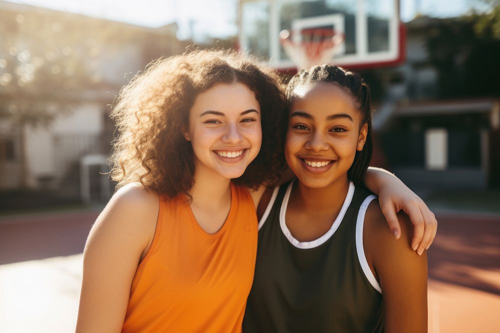 Diverse teen women wearing basketball team outfit laughing portrait outdoors. AI generated Image by rawpixel.