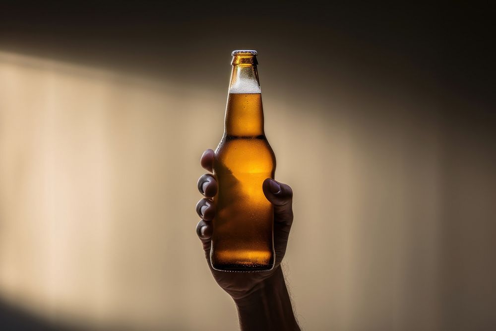 Bottle beer drink hand. AI generated Image by rawpixel.