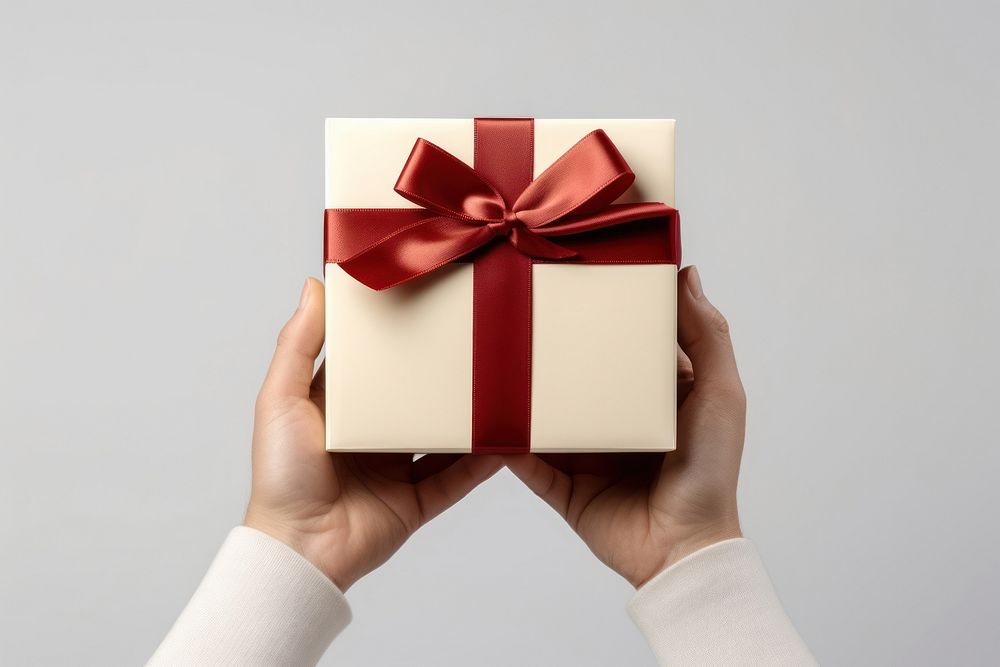 White gift box hand red celebration. AI generated Image by rawpixel.