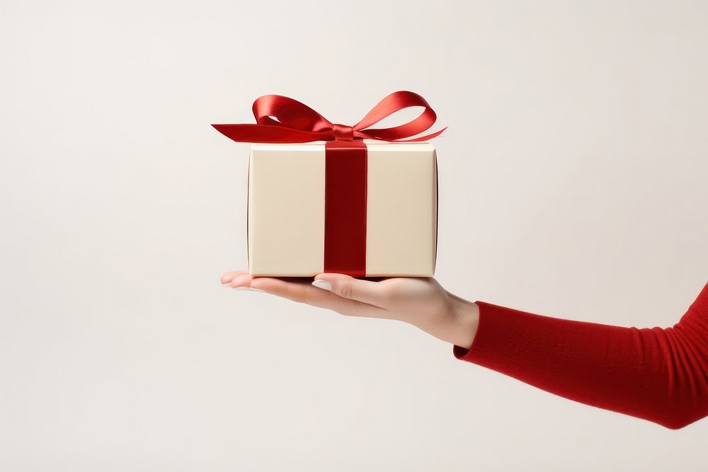 Gift box hand red celebration. AI generated Image by rawpixel.