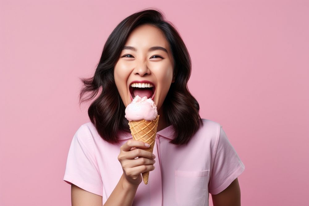 Asian woman licks delicious ice cream dessert adult food. AI generated Image by rawpixel.