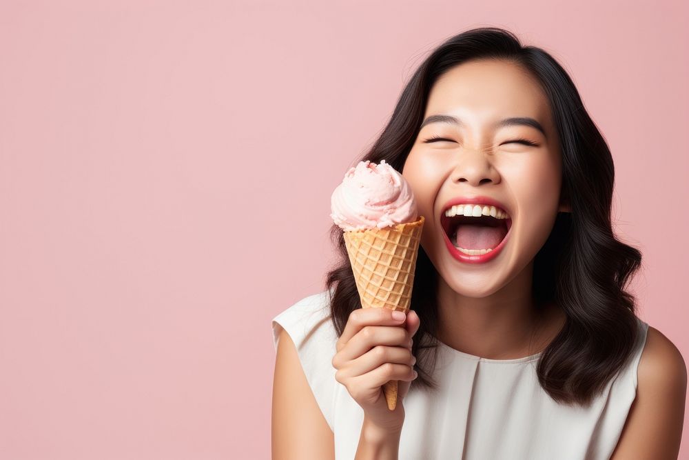 Asian woman licks delicious ice cream laughing dessert happy. AI generated Image by rawpixel.