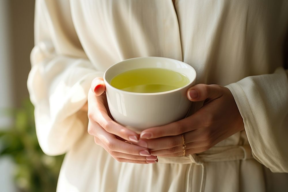 Green tea drink cup holding. Free Photo rawpixel
