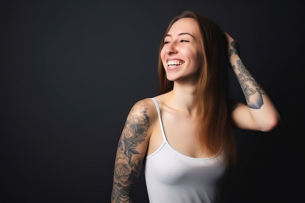 Young woman tattoo laughing portrait. AI generated Image by rawpixel.