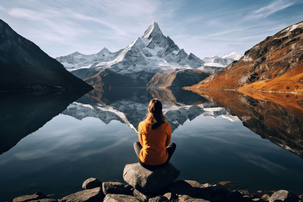 Mountain outdoors sitting lake. AI generated Image by rawpixel.