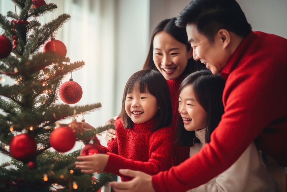 Asian family decorating christmas tree holiday child adult. AI generated Image by rawpixel.