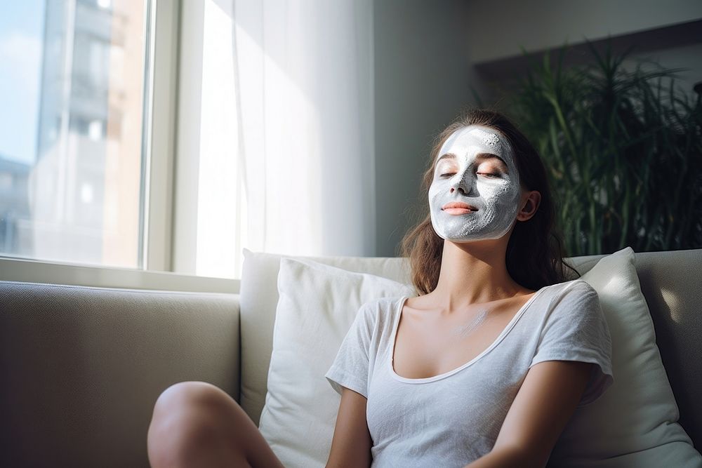 Woman wearing beauty face mask sitting adult sofa. AI generated Image by rawpixel.