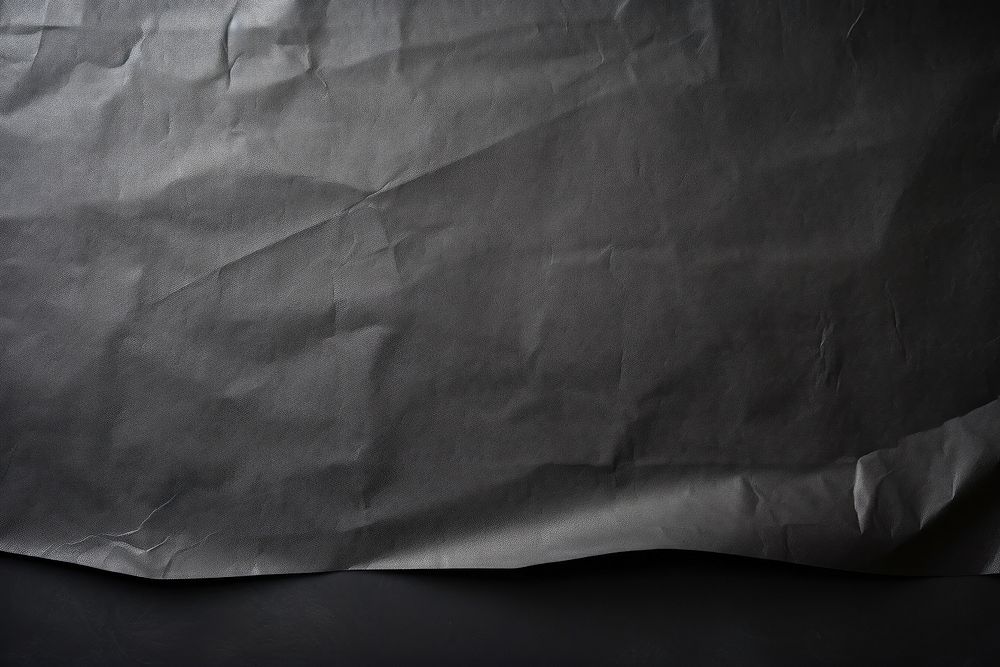 Paper backgrounds wrinkled black. AI generated Image by rawpixel.