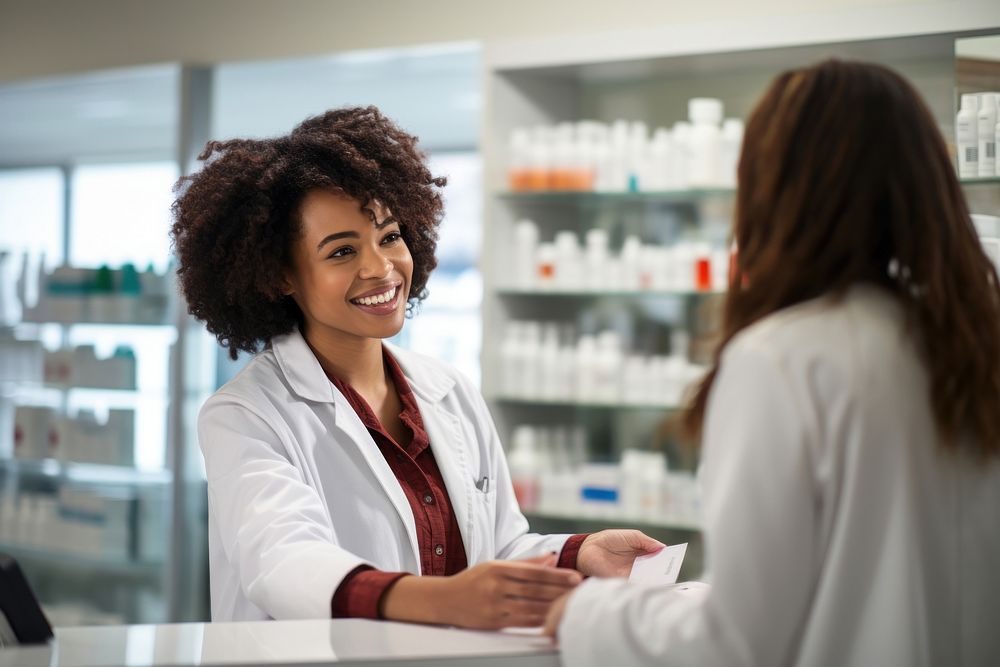 A pharmacist woman customer medicine smiling. 