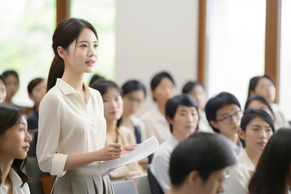 Smart japanese woman teaching audience student seminar people. AI generated Image by rawpixel.