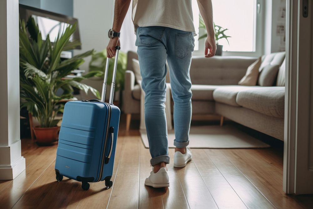 Luggage suitcase walking jeans. AI generated Image by rawpixel.