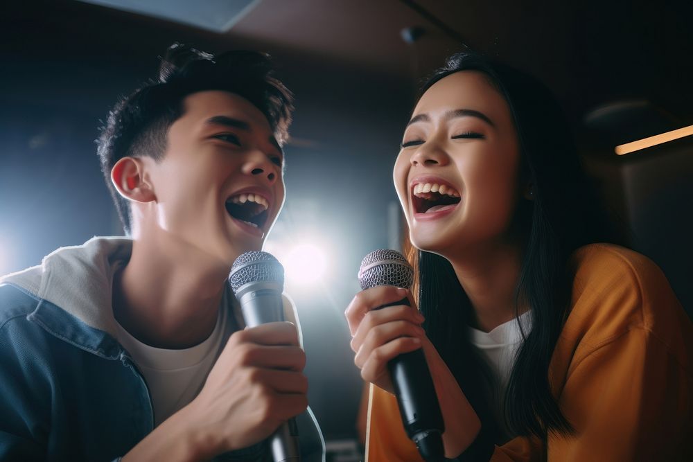 Filipino teenage friends karaoke entertainment microphone. AI generated Image by rawpixel.