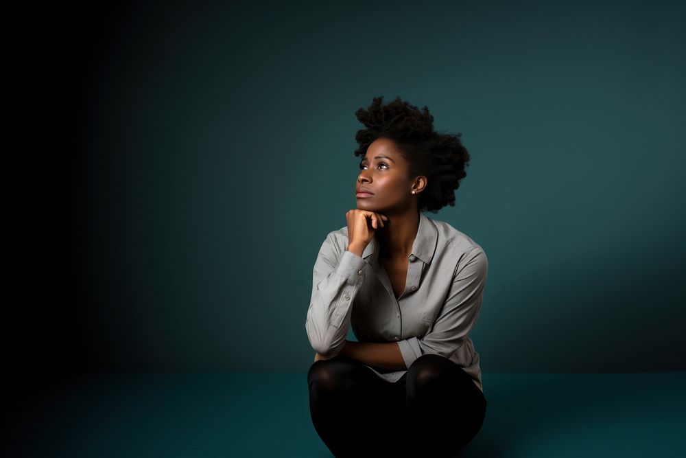 African american woman sitting portrait worried. AI generated Image by rawpixel.