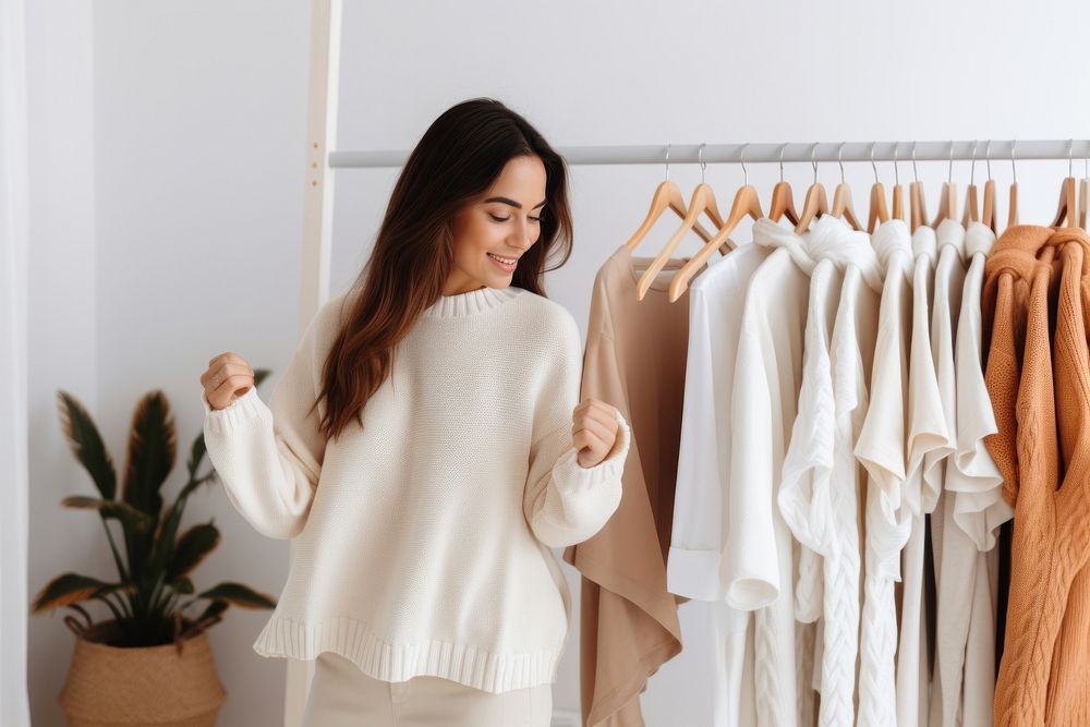 Latina woman choosing a sweater closet sleeve adult. AI generated Image by rawpixel.