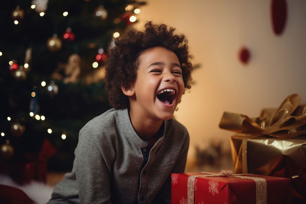 A boy laughing christmas christmas tree anticipation. AI generated Image by rawpixel.