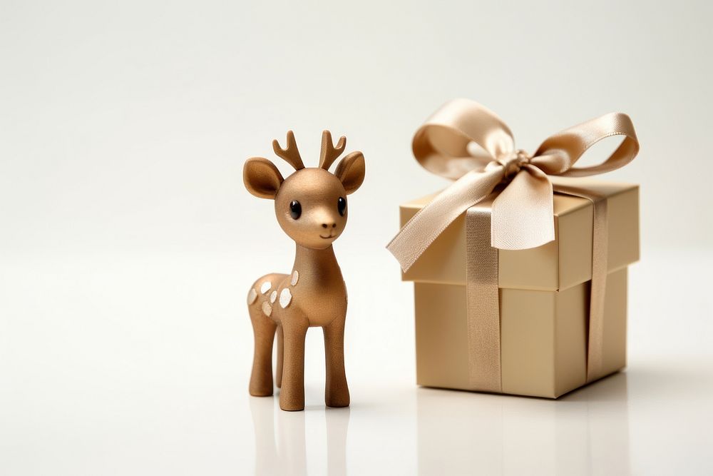 Christmas reindeer box figurine mammal. AI generated Image by rawpixel.
