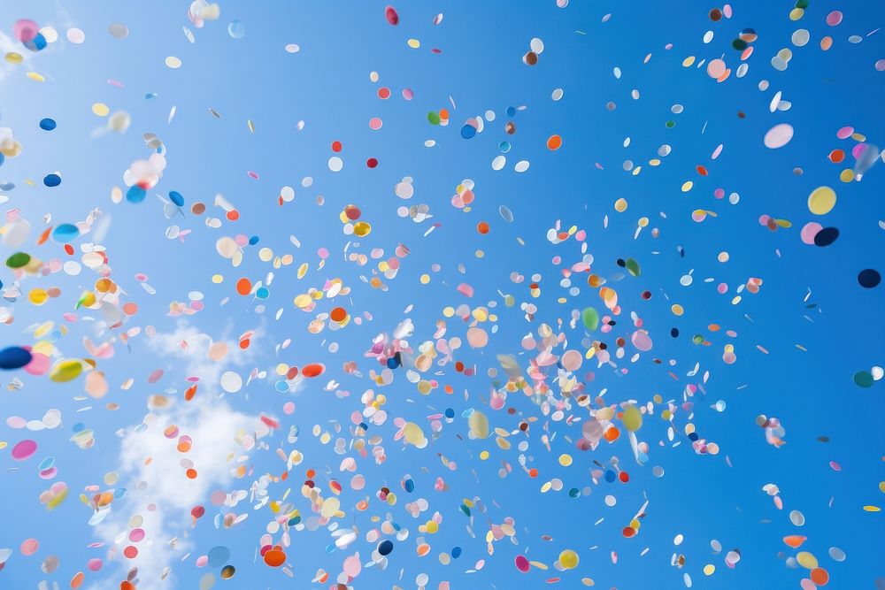Confetti outdoors blue sky. AI generated Image by rawpixel.