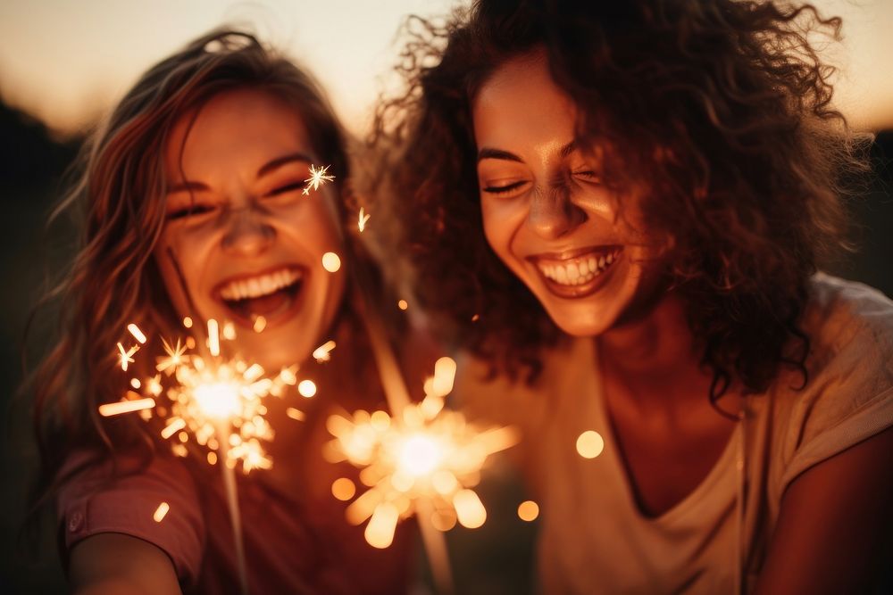 Laughing sparkler sparks female. AI generated Image by rawpixel.