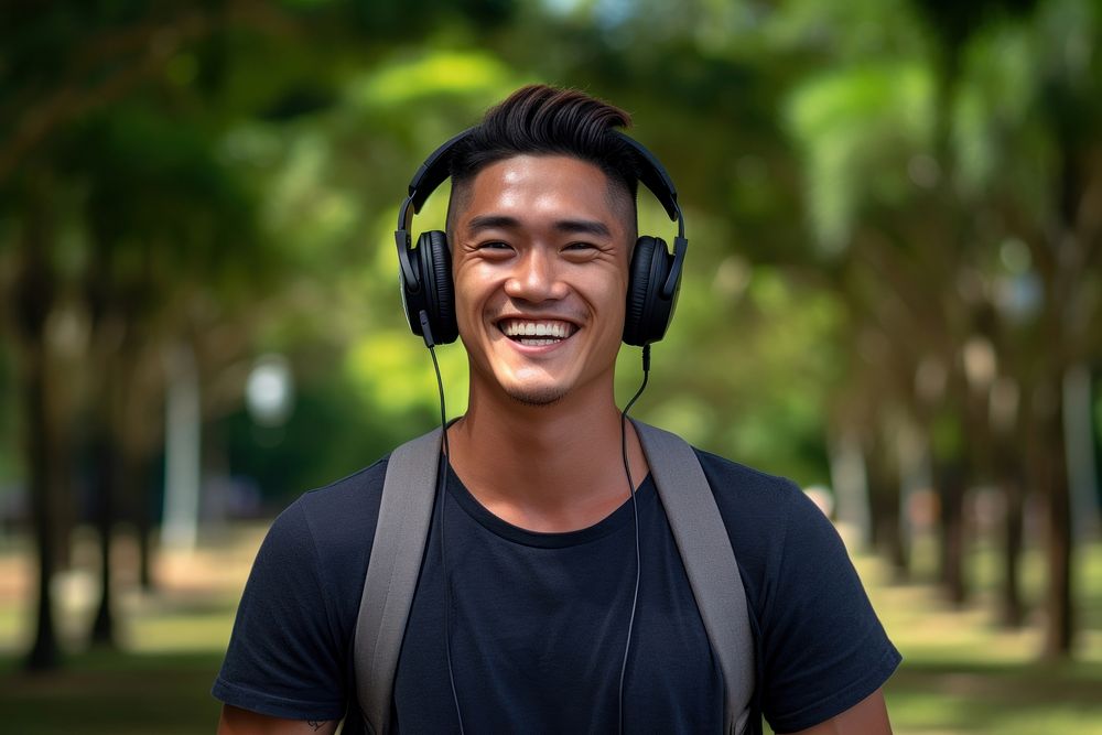 Singaporean man headphones listening headset. AI generated Image by rawpixel.