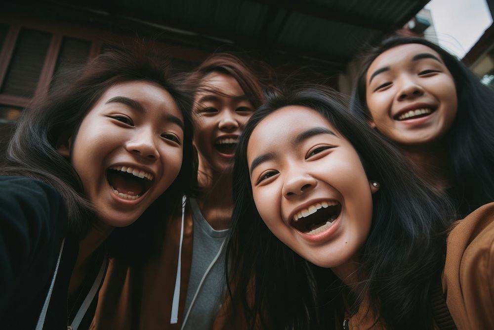 South East Asian teenage girls laughing selfie adult. AI generated Image by rawpixel.