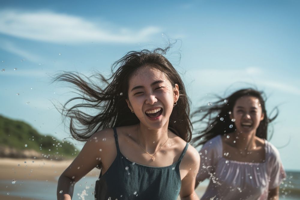 Vietnamese teenage friends laughing summer beach. AI generated Image by rawpixel.