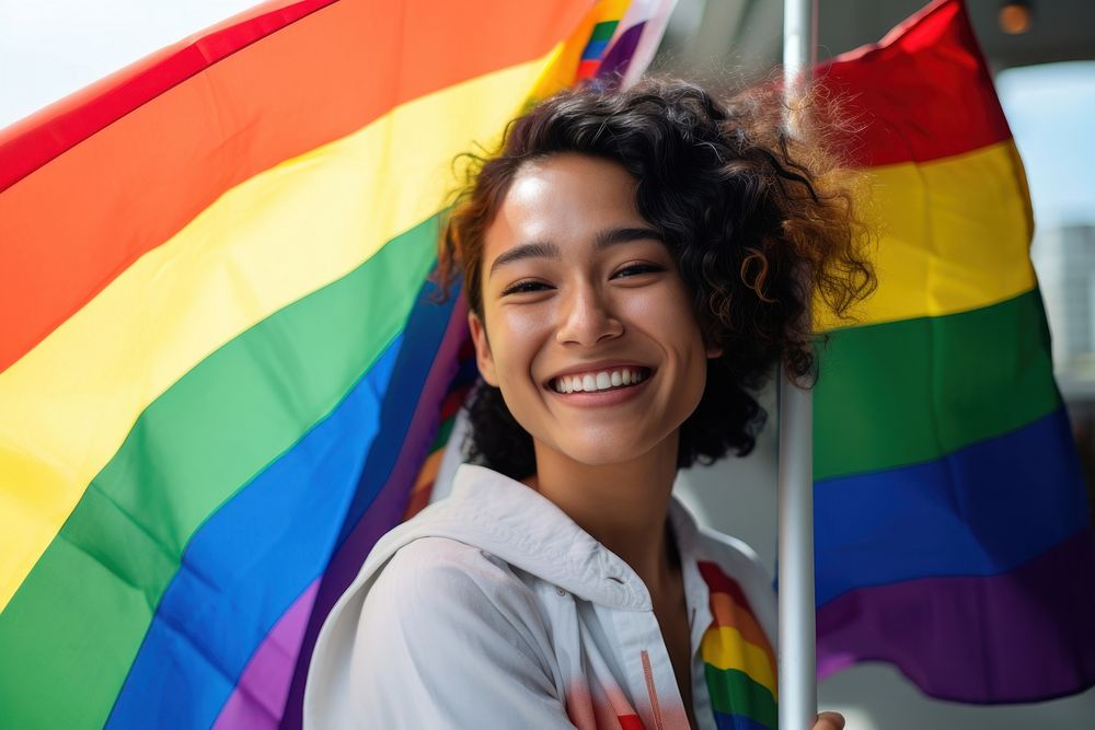 Thai woman holding rainbow pride. AI generated Image by rawpixel.