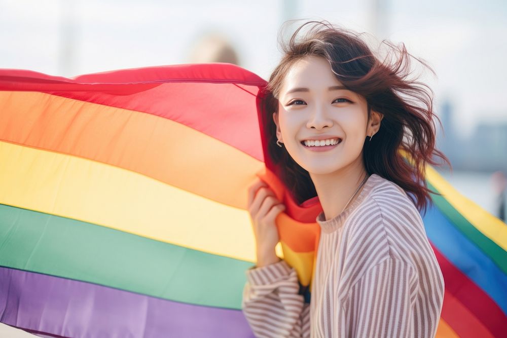 Thai woman holding rainbow smile. AI generated Image by rawpixel.