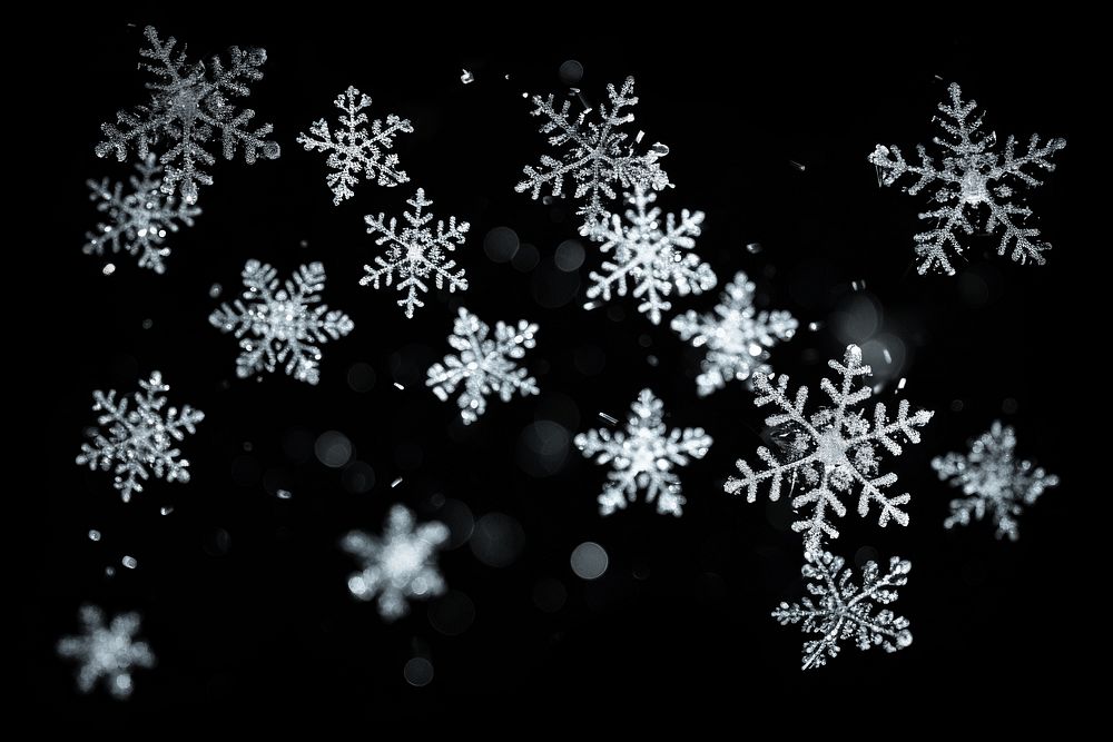 Snowflake backgrounds black background illuminated. AI generated Image by rawpixel.