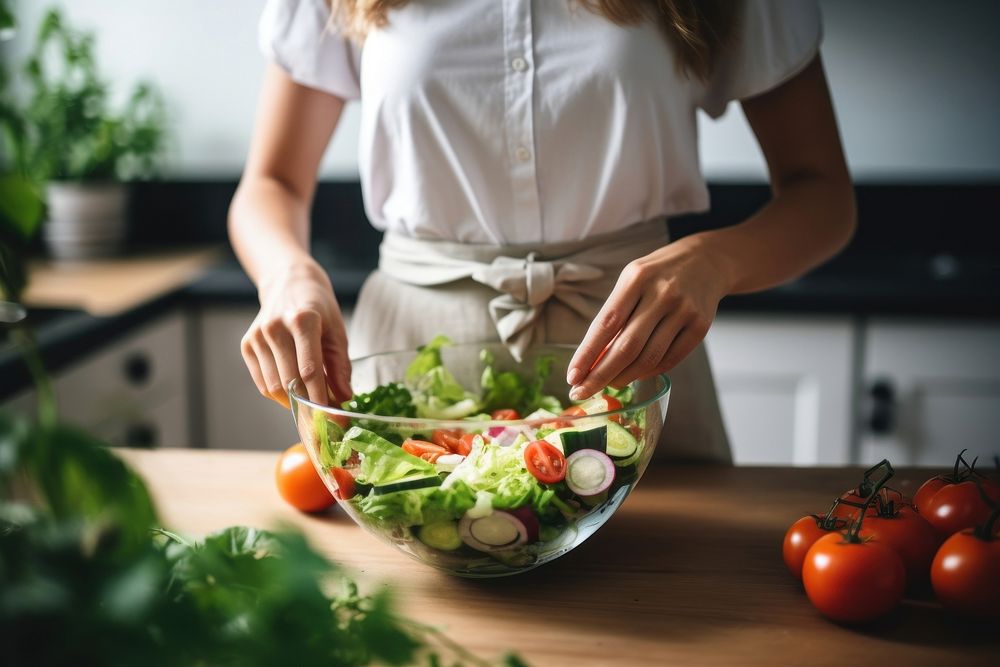 Cooking fresh vegetable salad kitchen adult woman. AI generated Image by rawpixel.