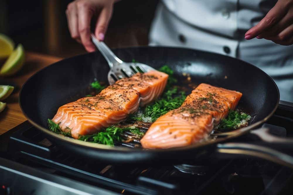 Frying Salmon steak seafood cooking kitchen. AI generated Image by rawpixel.