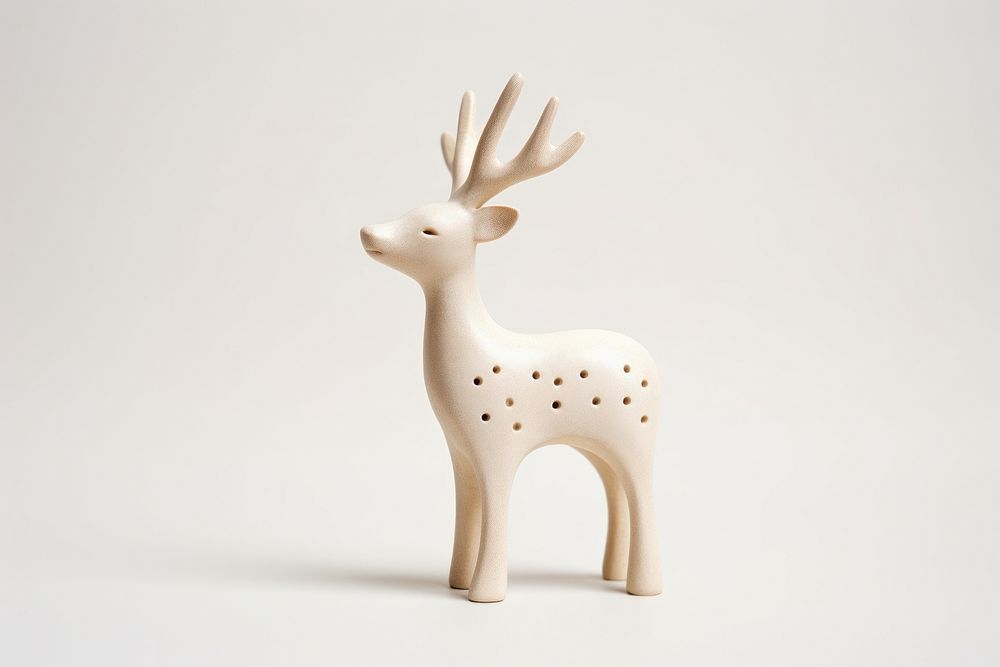 Cream ceramic reindeer decoration wildlife figurine. AI generated Image by rawpixel.