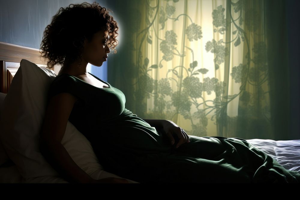 Pregnant woman sits furniture adult bed. AI generated Image by rawpixel.