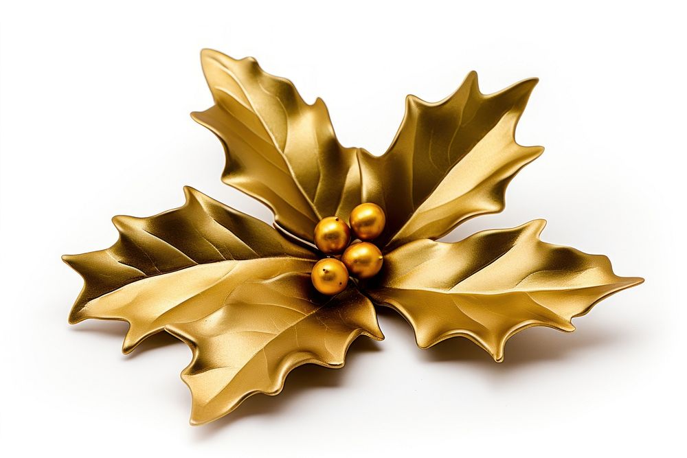 Gold christmas holly jewelry brooch plant. AI generated Image by rawpixel.