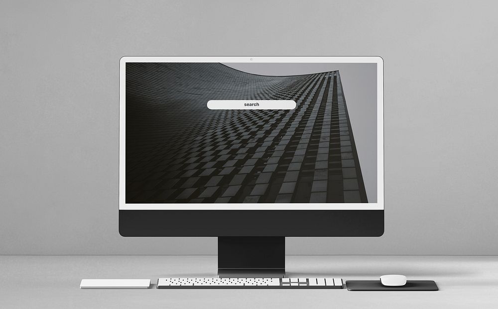 Computer screen with black building as wallpaper