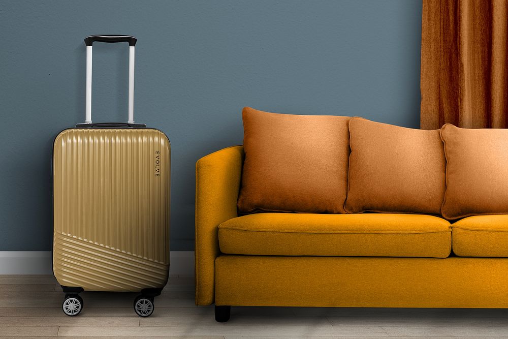 Travel luggage by a sofa