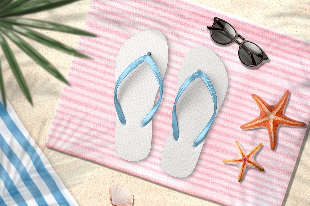 White beach sandals on pink towel