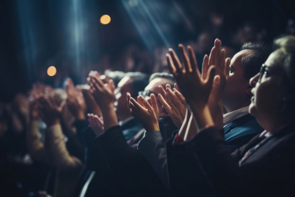 People clapping hands adult illuminated performance. AI generated Image by rawpixel.