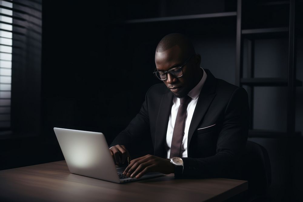 African American man computer sitting working. AI generated Image by rawpixel.