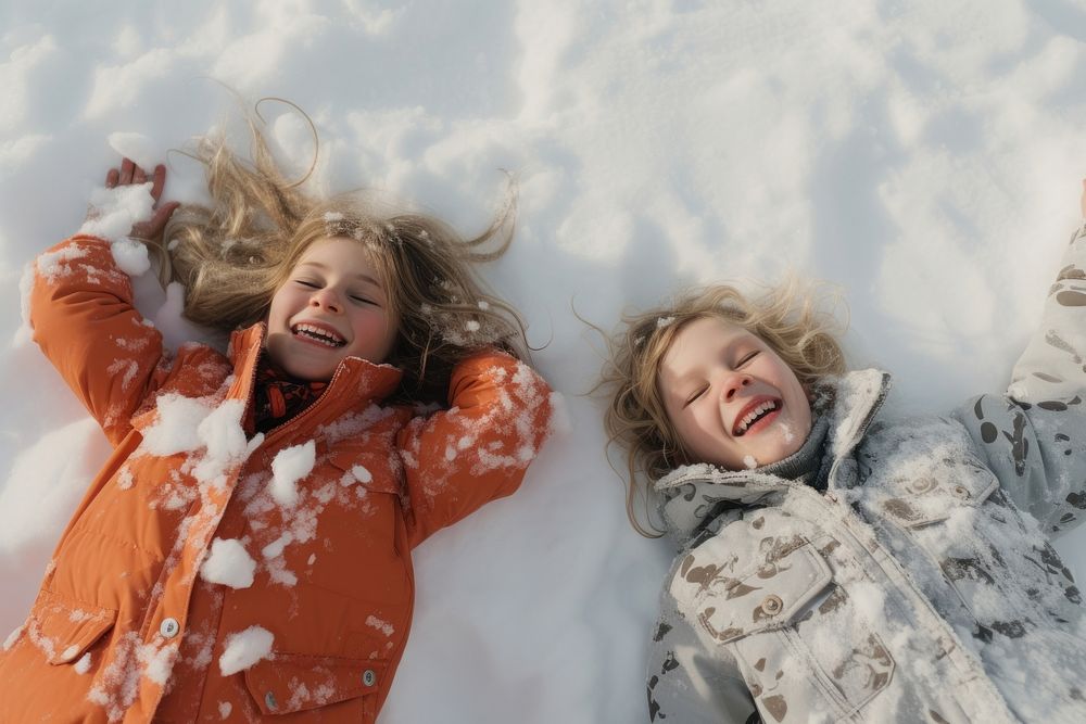 Snow angels laughing portrait outdoors. AI generated Image by rawpixel.