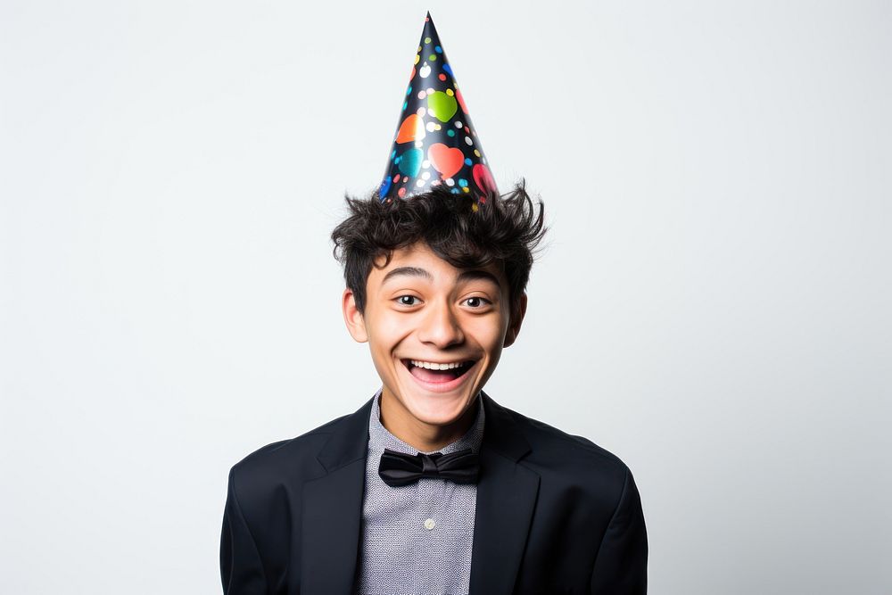 Southeastasian boy wearing party hat portrait adult smile. AI generated Image by rawpixel.