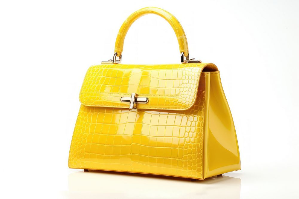 Yellow luxury handbag purse white background accessories. AI generated Image by rawpixel.