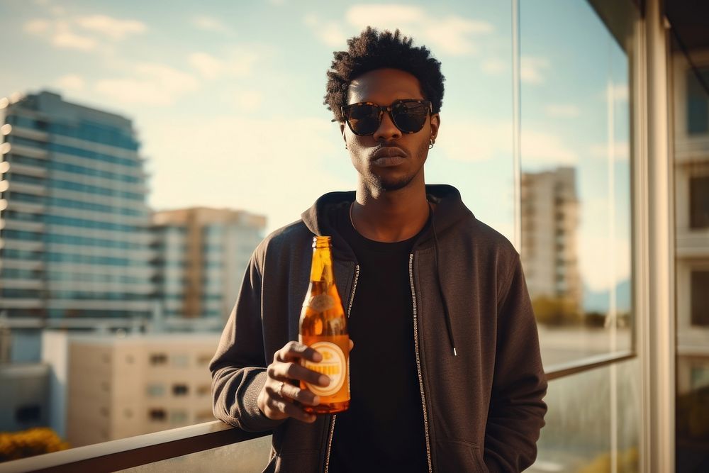 Young stylish black man bottle beer sunglasses. AI generated Image by rawpixel.