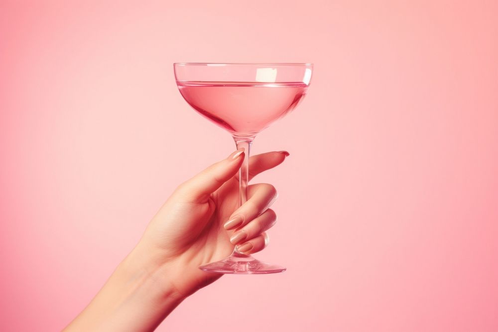 Cocktail glass drink holding. AI generated Image by rawpixel.