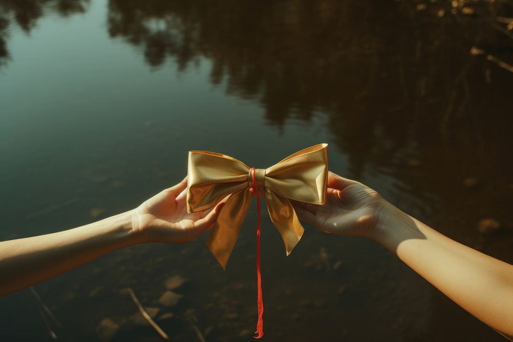 Big bow hand holding plant. AI generated Image by rawpixel.